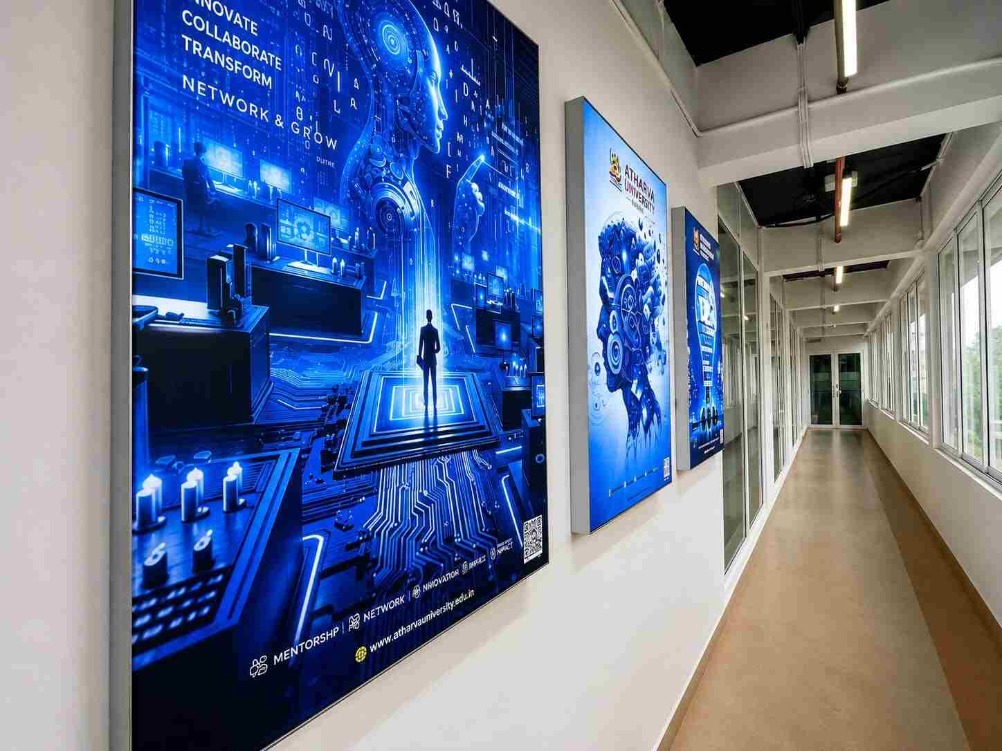 IIBC corridor with 'Innovate Collaborate Transform, Network & Grow' displays